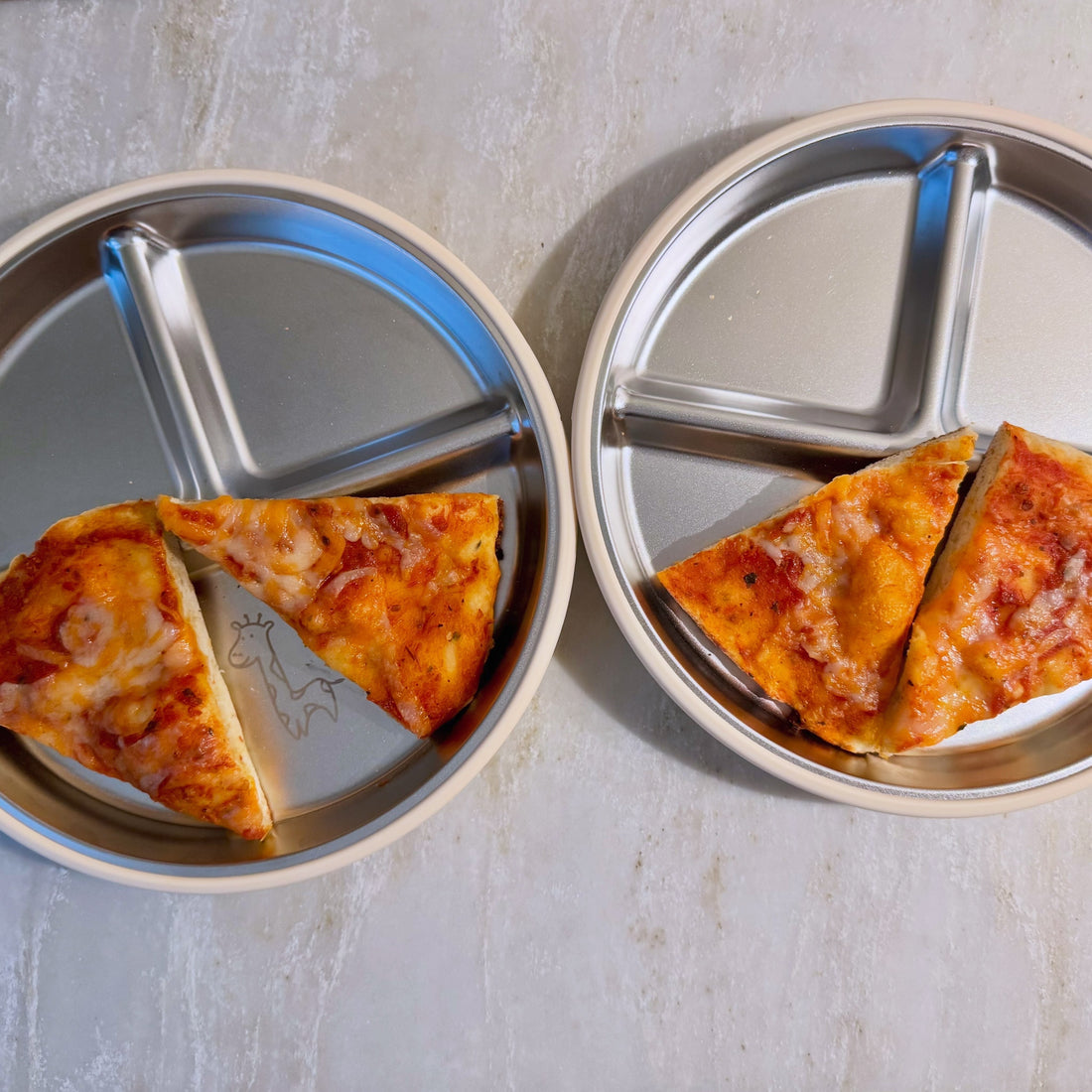 Homemade pizza slices served on stainless steel plate