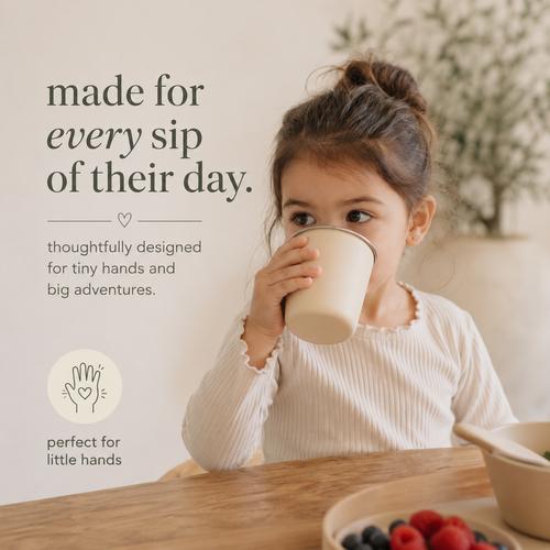 Toddler drinking from BRAI + CO. open cup